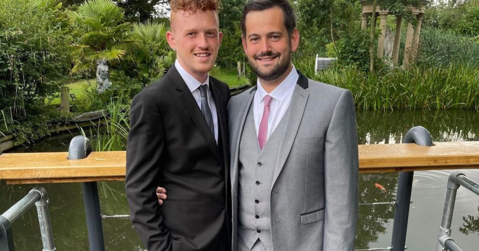 Ricardo and Bradleigh, a gay couple, wear suits and smile at the camera in an image shared as part of their promotion of fostering as a way to expand a family