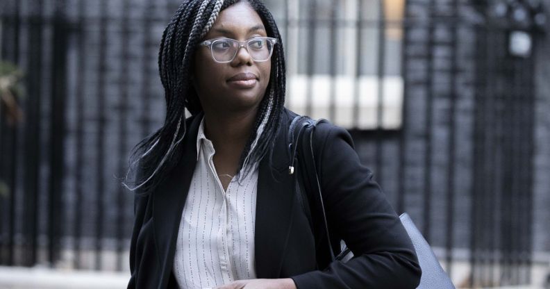 Kemi Badenoch walks across the streets of Number 10, wearing a black blazer.