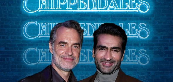 A promo shot for Disney+ series Welcome to Chippendales shows actors Murray Bartlett and Kumail Nanjiani standing next to each other smiling with a blue neon sign behind them says: "Chippendales"