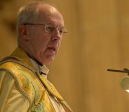 The Archbishop of Canterbury, speaking at a podium while wearing ceremonial robes.
