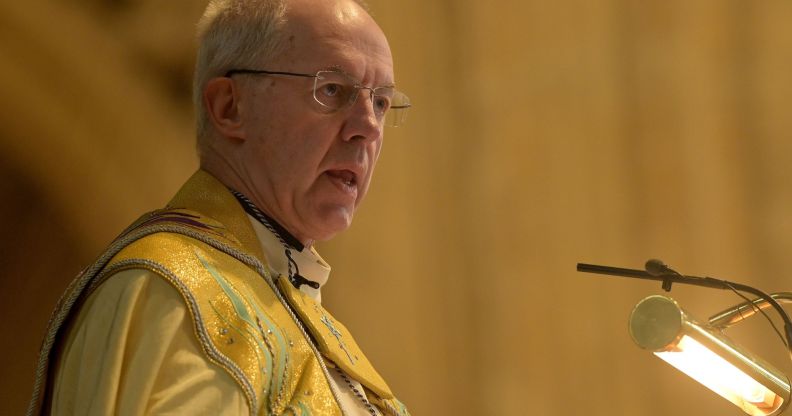The Archbishop of Canterbury, speaking at a podium while wearing ceremonial robes.