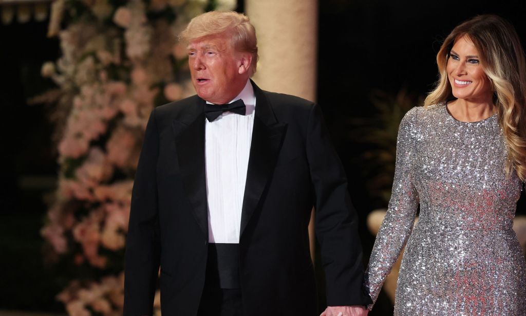 Donald Trump and wife Ivanka walk side by side holding hands while at their New Year's Eve party at Mar-a-Lago