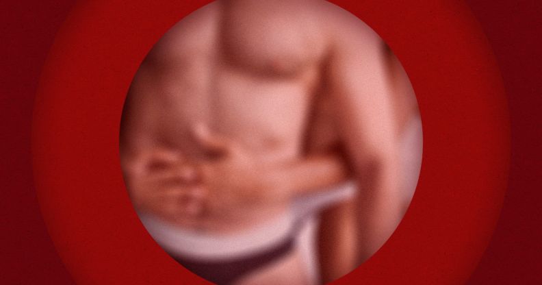 A blurred torso against a red background