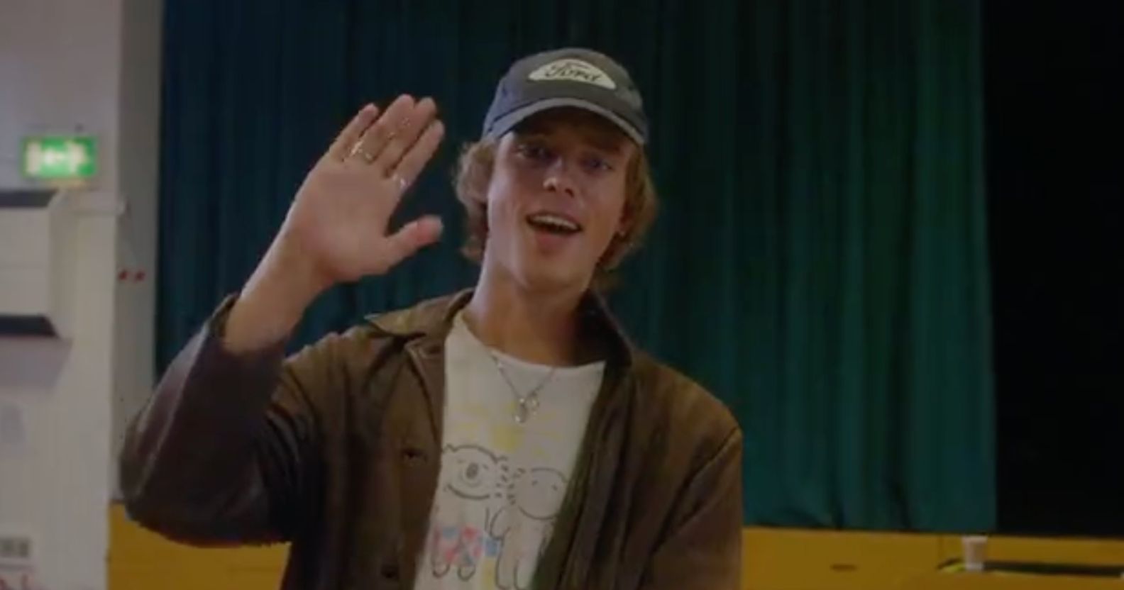 Actor Jack Barton waves during a reading for Heartstopper season 2, in which he plays David Nelson