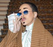 A photo of American rapper Doja Cat wearing eyelashes as eyebrows and as a moustache at Paris Fashion Week