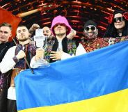 Eurovision Song Contest 2022 winners Kalush Orchestra holding a Ukrainian flag