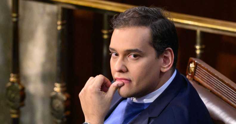 Newly elected Republican Representative from New York, George Santos wearing a blue suit looks on as the US House of Representatives convenes for the 118th Congress at the US Capitol in Washington, DC, January 3, 2023.