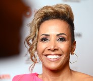 A close-up photo of athlete Dame Kelly Holmes wearing a pink dress as she attends the European Diversity Awards