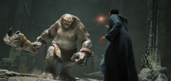 A student at Hogwarts uses a wand against a giant troll.