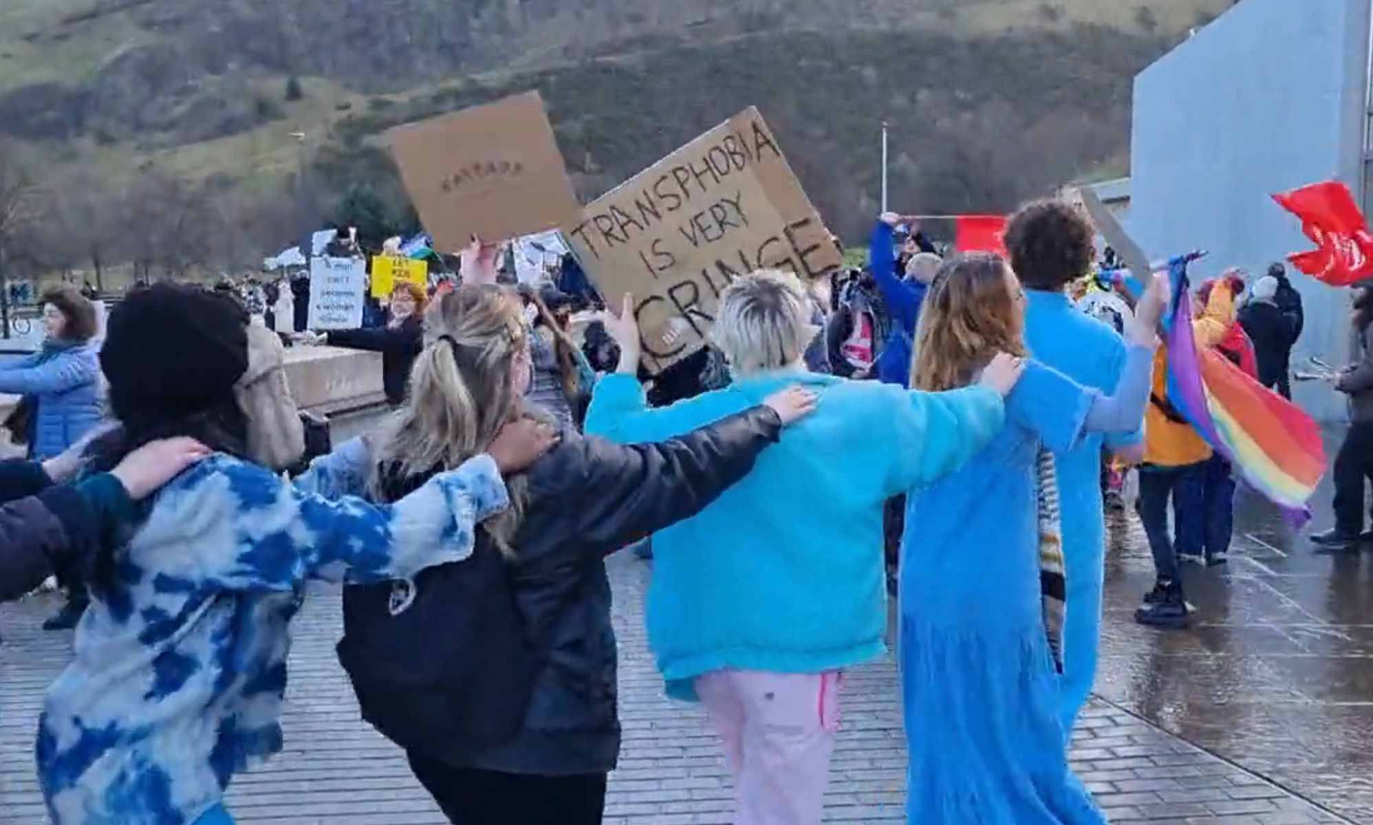 Trans rights protesters do the Time Warp at Scots parliament to drown out bigots