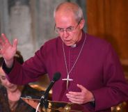 Justin Welby speaks in a purple robe during an event.