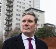 Keir Starmer pictured out canvassing wearing a suit and tie.