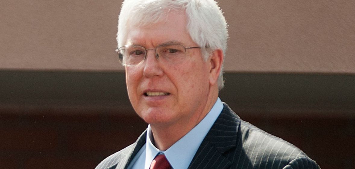 Mat Staver awkwardly smiles during a press conference.