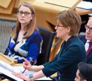 A screenshot of Nicola Sturgeon wearing a navy suit as she talks during First Ministers Questions at the Scottish Parliament