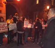 A photo shows LGBTQ+ protesters outside Lambeth Palace. To the right is Labour MP Ben Bradshaw