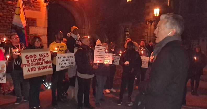 A photo shows LGBTQ+ protesters outside Lambeth Palace. To the right is Labour MP Ben Bradshaw