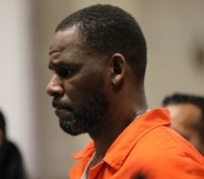 A photo shows disgraced singer R Kelly wearing an orange top during his trial. (Getty)