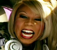 A still from MTV's News clip showing a close-up of drag queen RuPaul smiling to the camera witht the logo of MTV News appearing on the bottom left-hand side of the image