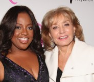 A photo of American actor and broadcaster Sherri Shepherd wearing a black evening dress and Barbara Walters wearing a white jacket over a black top
