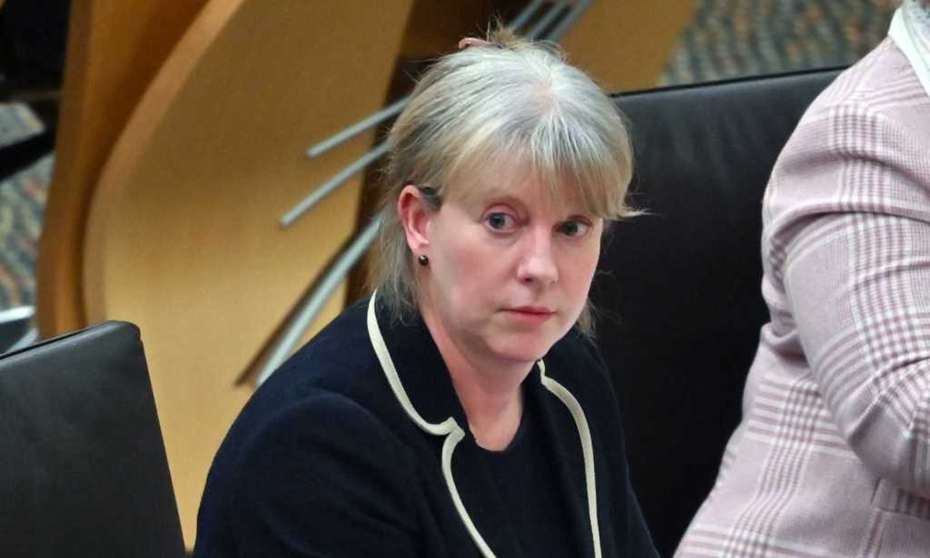 Shona Robison, Scotland's social justice secretary, pictured wearing a black suit in the Scottish Parliament.