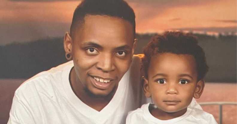 Trans dad Tanius Posey wearing a white top is pictured with his baby Za’nius who is also dressed in white
