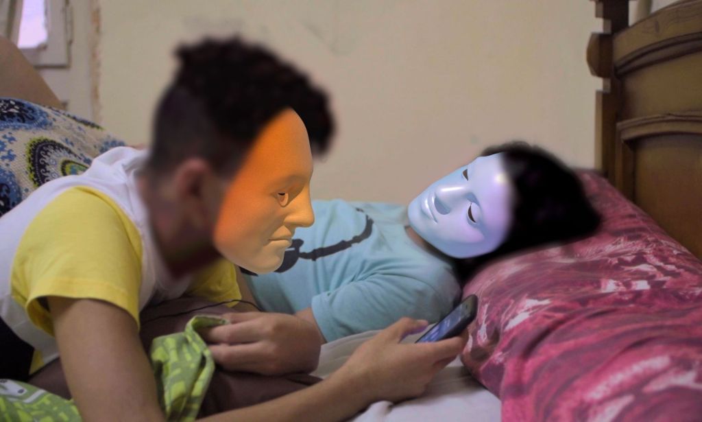 Laila, a trans person whose identity has been protected by masking technology, talks to her best friend while both of them hang out and discuss being freed from discrimination as part of the LGBTQ+ community in Egypt