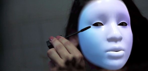 Laila, a trans person whose identity has been protected by masking technology, puts on makeup as she shares stories of being persecuted for being part of the LGBTQ+ community in Egypt