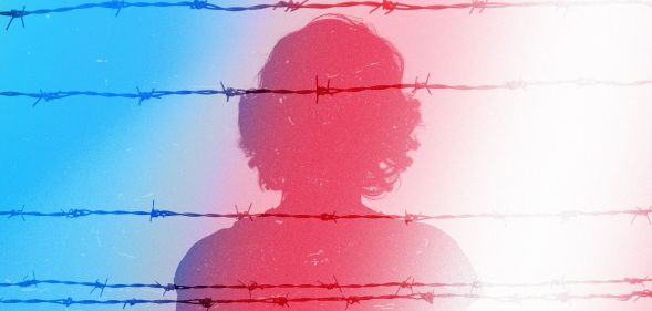 The silhouette of a women against prison wires in the colours of the trans Pride flag