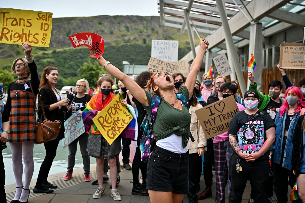 An anti-trans demonstrator stands in front of a counter demonstration by Trans rights activists on September 02, 2021 in Edinburgh.
