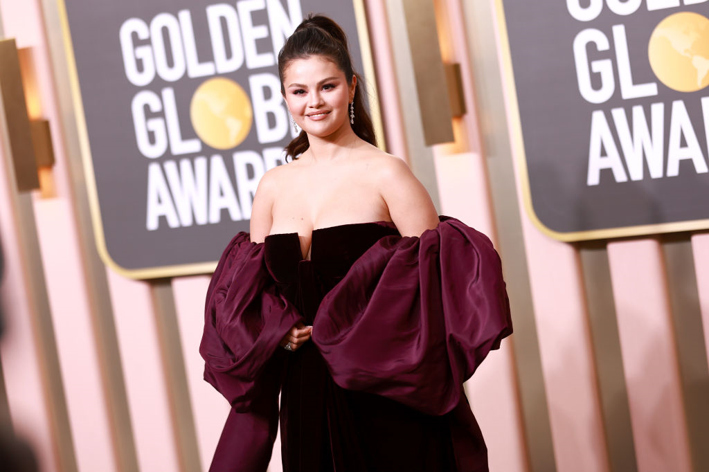 Selena Gomez wears and burgundy dress at the Golden Globe Awards