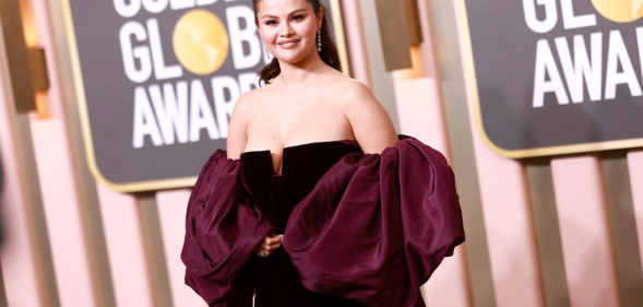 Selena Gomez wears and burgundy dress at the Golden Globe Awards
