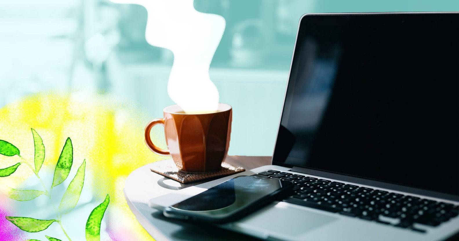 A steaming cup of coffee sits next to an open laptop and mobile phone.