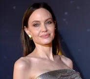 Angelina Jolie in a silver Versace dress on the red carpet for Marvel's Eternals