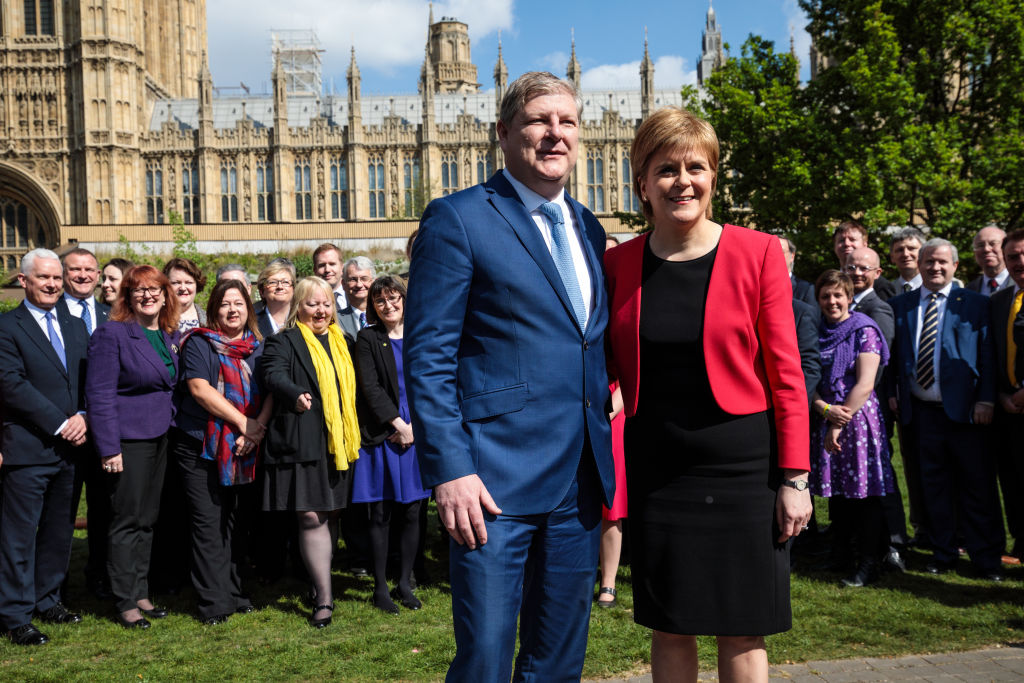 Nicola Sturgeon (R) and Deputy Leader Angus Robertson (L) are joined by the Party's Westminster group.