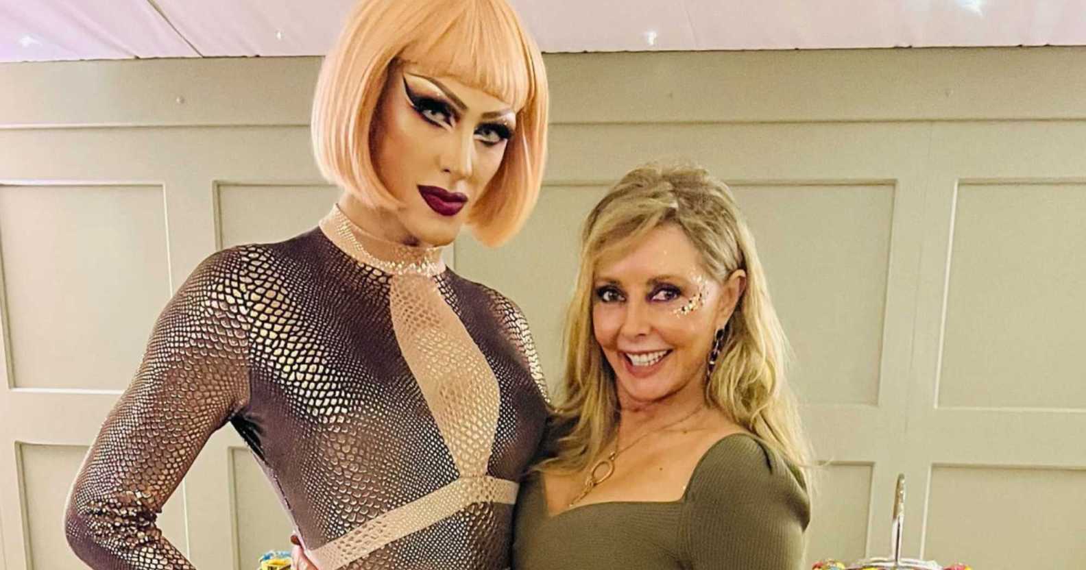 An Instagram photo shows Carol Vorderman wearing a light green dress posing with drag queen who's wearing a silver dress