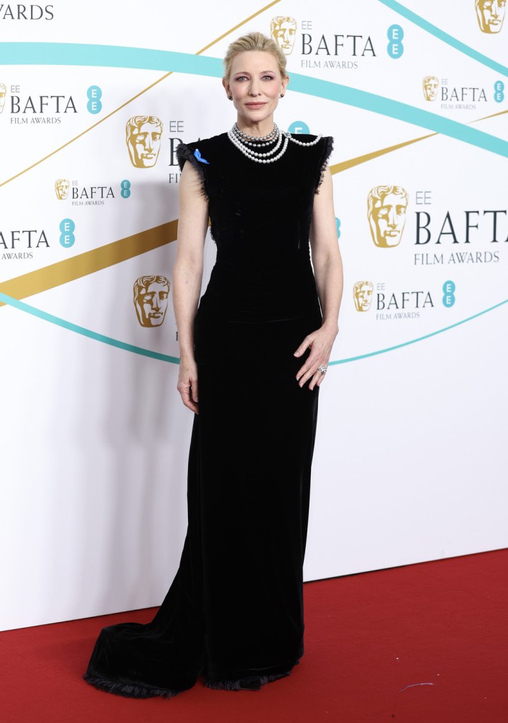 Cate Blanchett wears a black gown and white pearls on the BAFTA 2023 red carpet.