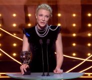 Cate Blanchett on stage at the 2023 BAFTA Awards holding her BAFTA for Best Actress.