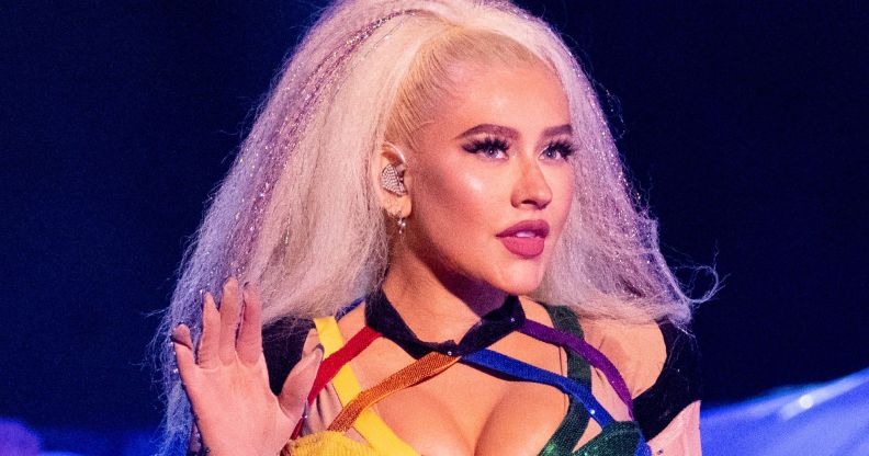 Christina Aguilera performing in a strappy rainbow top at LA pride.