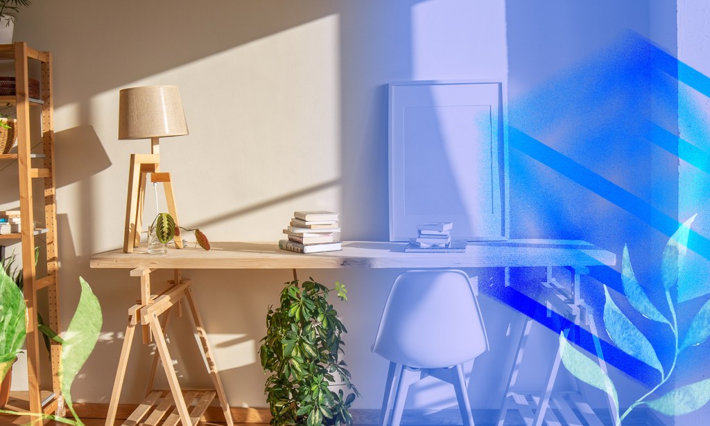 A home office is depicted with plants with lamp.