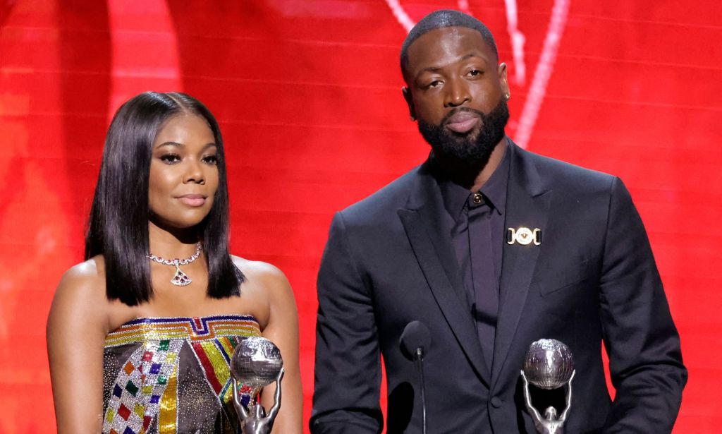Dwyane Wade and Gabrielle Union accept the President's Award at the NAACP Image Awards.