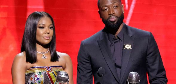 Dwyane Wade and Gabrielle Union accept the President's Award at the NAACP Image Awards.