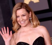 Elizabeth Banks waves while on the red carpet Academy Of Motion Picture Arts And Sciences 13th Governors Awards.