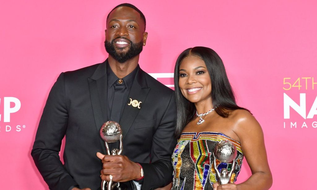 Dwyane Wade and Gabrielle Union accept the NAACP President's Award.