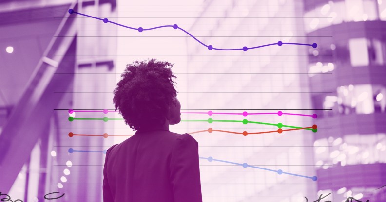 A woman is looking off into the distance in an urban location.