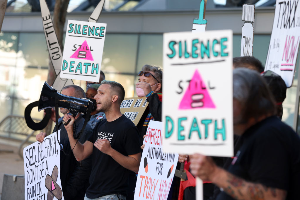 LGBTQ rights activists holds signs as they stage a protest outside of the San Francisco Federal Building on August 08, 2022. 