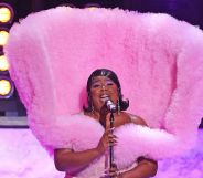 Lizzo wearing a fluffy pink elaborate gown while performing at the Brit Awards.