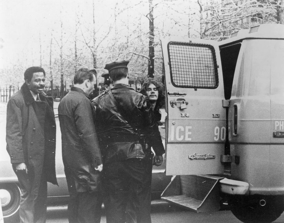 Mark Segal (right) next to a police van