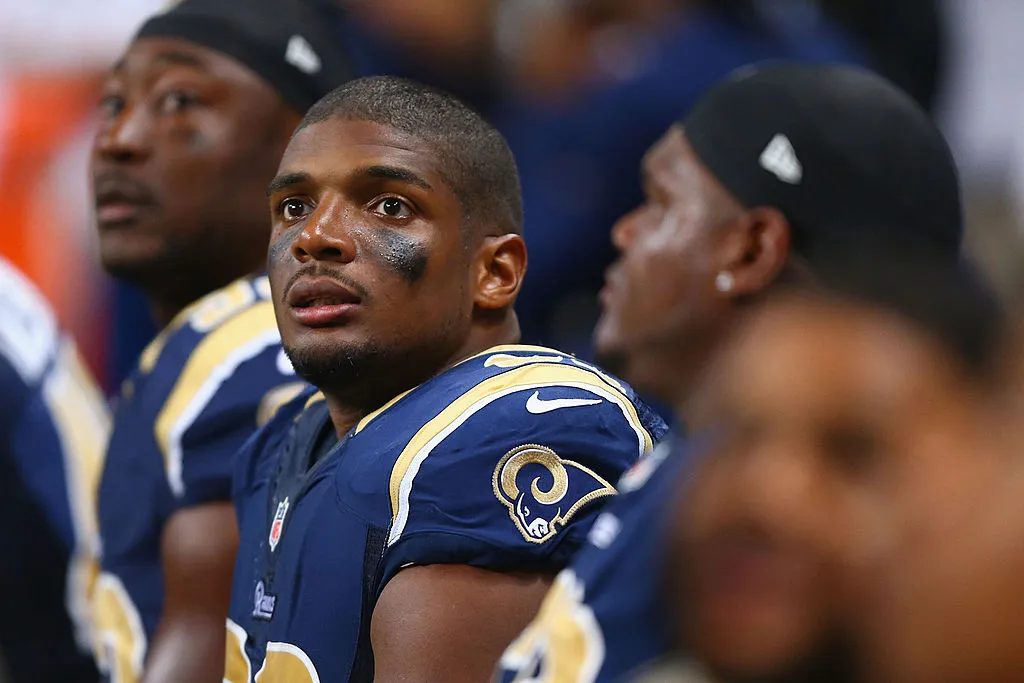 Michael Sam #96 of the St. Louis Rams watches from the bench during the second half of a pre-season against the New Orleans Saints game at the Edward Jones Dome on August 8, 2013 in St. Louis, Missouri. The Saints beat the Rams 26-24.