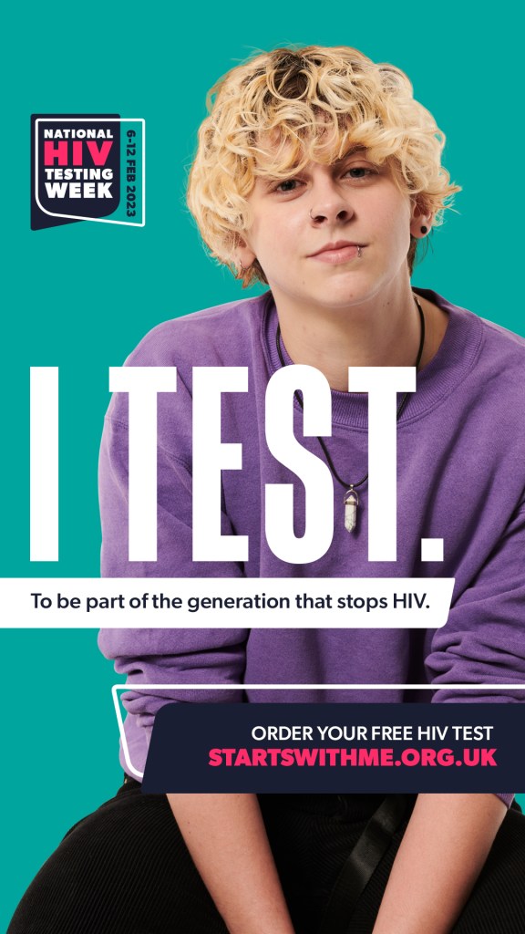 Singer-songwriter Noah Finnce pictured in a promotional image for the Terrence Higgins Trust for HIV Testing Week. He is pictured with long blonde hair wearing black trousers and a purple sweater on a stool against a green background. Written in large white writing in the middle are the words "I test 
