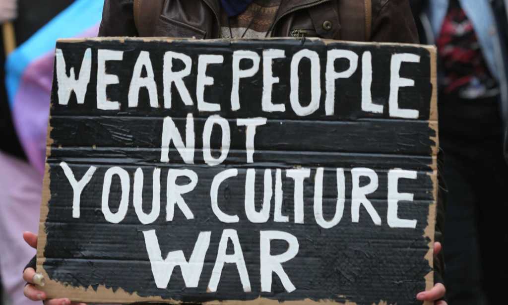 Protest sign reads We are People not your Culture War